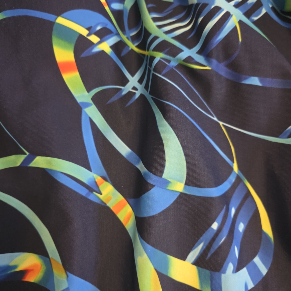 Blue, Green, Yellow, and Orange Boy Short Bathing Suit. - Picture 3 of 4